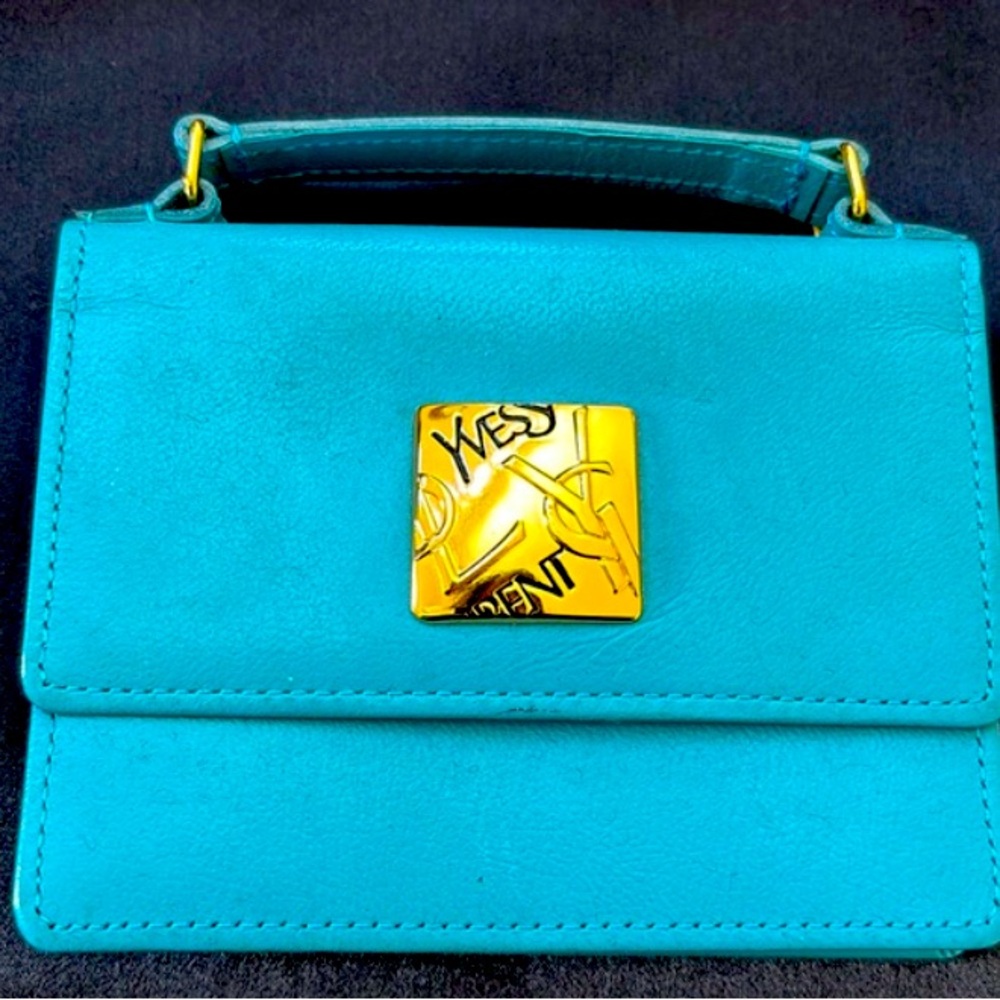 Yves saint  Laurent  small purse cross body chain not included I can sell it